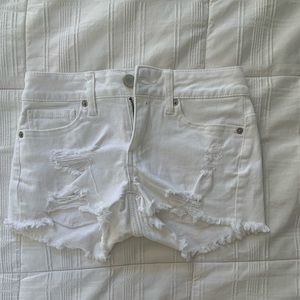 white ripped shorts